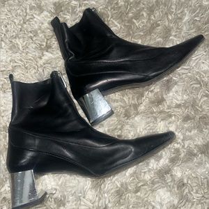 Black leather zip front bootie with silver mirror heel